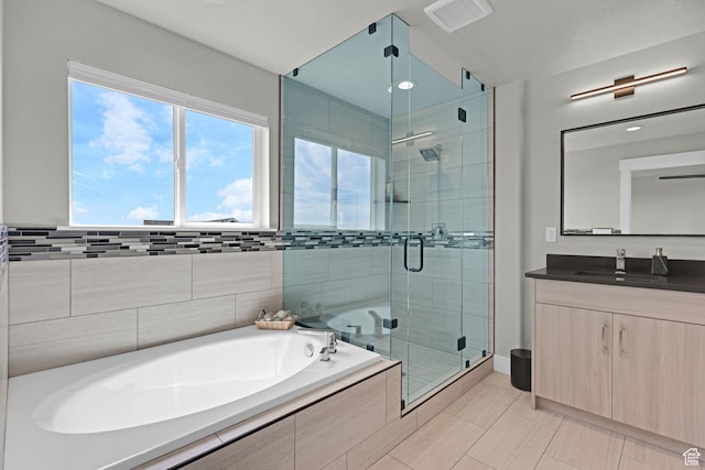3877 N 425 E, North Ogden, UT 84414 - full bathroom featuring a bath, vanity, a stall shower, and tile patterned floors