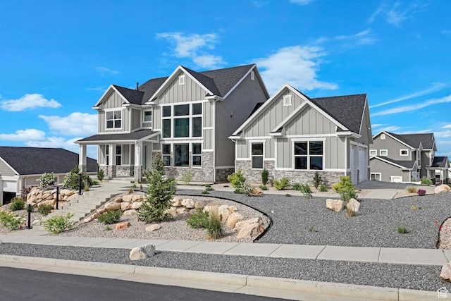 3877 N 425 E, North Ogden, UT 84414 - craftsman house featuring board and batten siding, stone siding, a garage, and a shingled roof