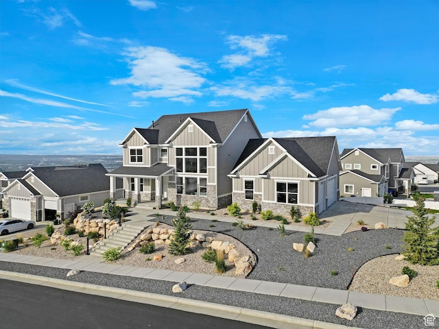 3877 N 425 E, North Ogden, UT 84414 - craftsman-style home with board and batten siding, stone siding, concrete driveway, a residential view, and an attached garage