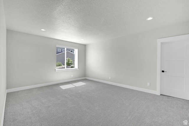 3877 N 425 E, North Ogden, UT 84414 - carpeted spare room with a textured ceiling, recessed lighting, and baseboards