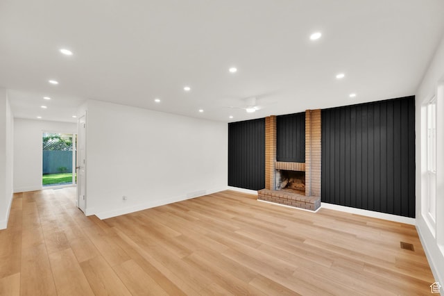 1210 E Bonner Way S, Millcreek, UT 84117 - unfurnished living room with recessed lighting, ceiling fan, light wood finished floors, baseboards, and a brick fireplace