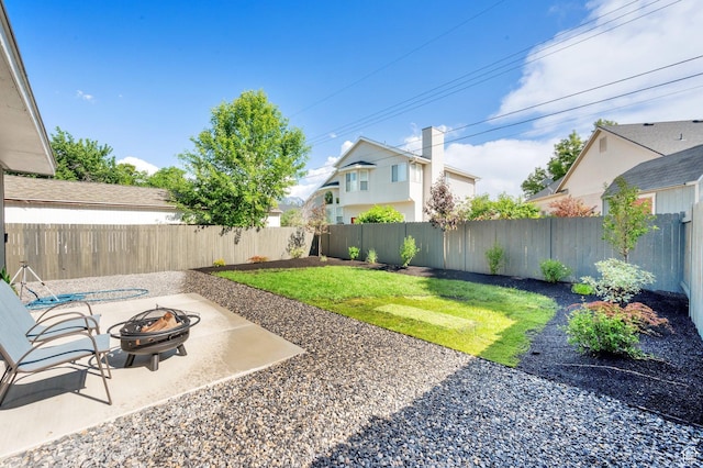 1210 E Bonner Way S, Millcreek, UT 84117 - view of yard featuring an outdoor fire pit and a patio area