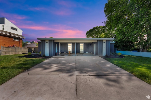 1210 E Bonner Way S, Millcreek, UT 84117 - single story home featuring board and batten siding, concrete driveway, and a carport