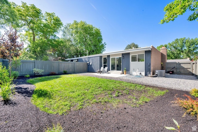 1210 E Bonner Way S, Millcreek, UT 84117 - back of house featuring a patio, a chimney, central AC, and a gate