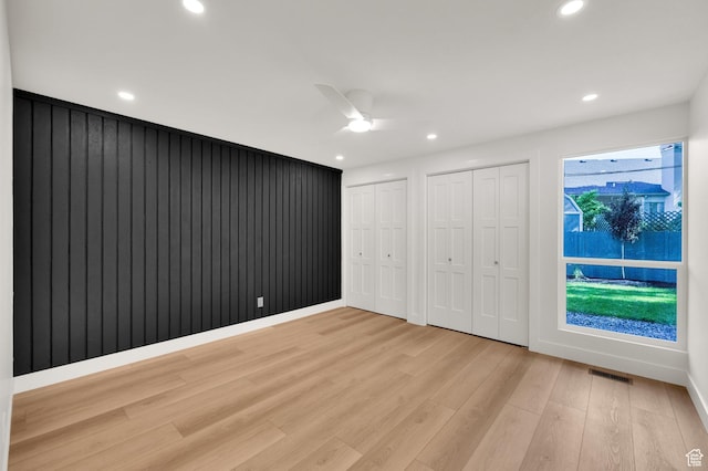 1210 E Bonner Way S, Millcreek, UT 84117 - unfurnished bedroom with two closets, light wood finished floors, recessed lighting, and ceiling fan