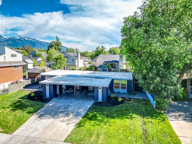 1210 E Bonner Way S, Millcreek, UT 84117 - view of front of home with a residential view, an attached carport, driveway, and a mountain view
