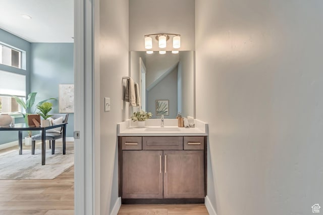 4237 S Birkhill Blvd, Murray, UT 84107 - bathroom with wood finished floors, vanity, and baseboards