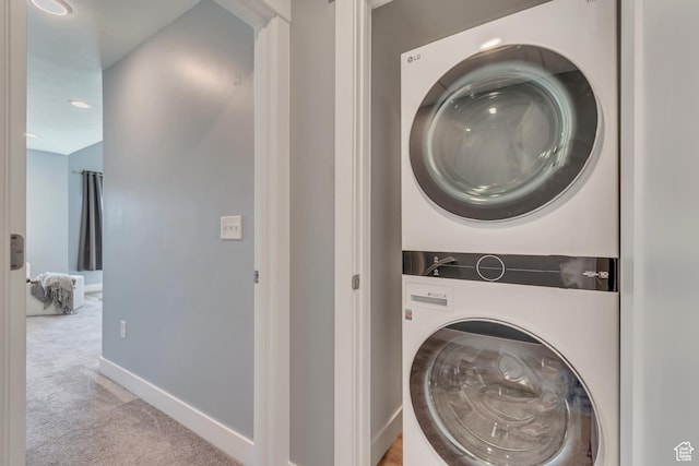 4237 S Birkhill Blvd, Murray, UT 84107 - laundry area with stacked washer / drying machine, light colored carpet, baseboards, and recessed lighting