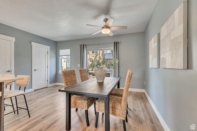 4237 S Birkhill Blvd, Murray, UT 84107 - dining room with light wood-style flooring, baseboards, and a ceiling fan