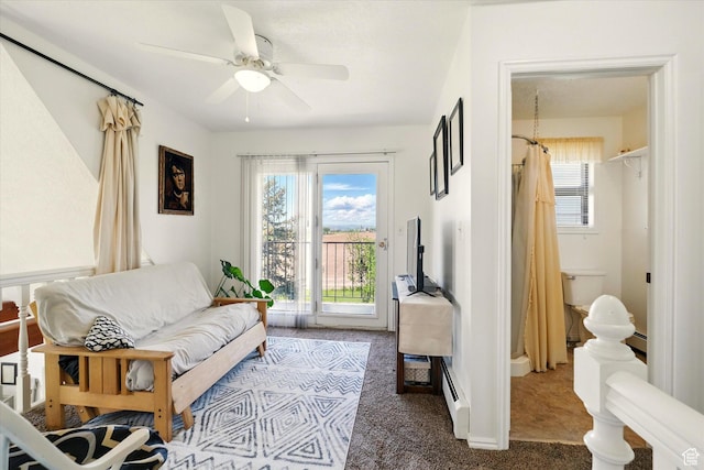 1777 W 4200 N, Smithfield, UT 84335 - living room with carpet, plenty of natural light, a ceiling fan, and a baseboard heating unit