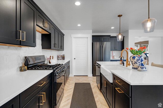 4609 N Kings Peak Way Unit 912, Eagle Mountain, UT 84005 - kitchen featuring range with gas stovetop, a sink, recessed lighting, light countertops, and an island with sink