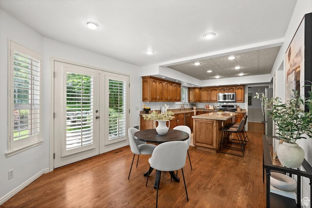 12563 S Bear Castle Cv, Draper, UT 84020 - dining area with wood finished floors, healthy amount of natural light, recessed lighting, and french doors