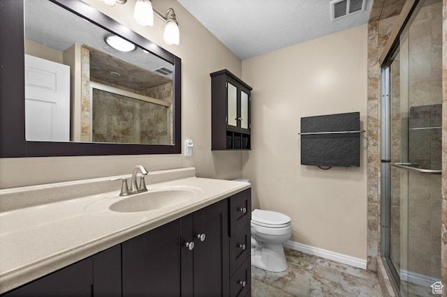 12563 S Bear Castle Cv, Draper, UT 84020 - bathroom featuring vanity, toilet, a stall shower, and baseboards