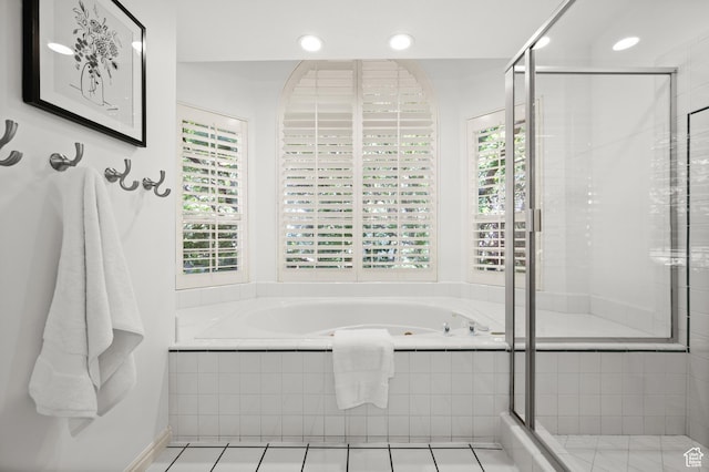 12563 S Bear Castle Cv, Draper, UT 84020 - bathroom featuring healthy amount of natural light, a garden tub, a shower stall, recessed lighting, and tile patterned flooring