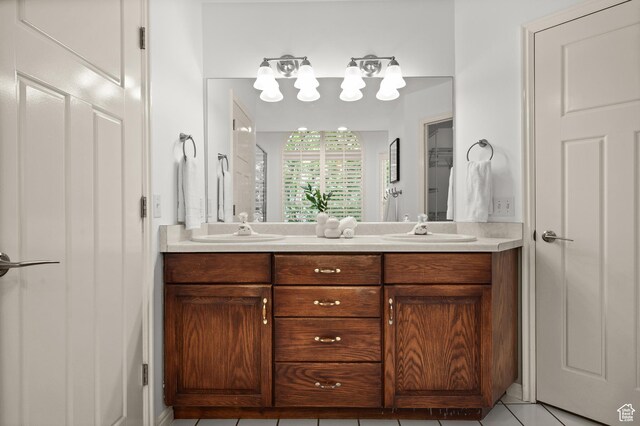 12563 S Bear Castle Cv, Draper, UT 84020 - full bathroom with double vanity and tile patterned floors