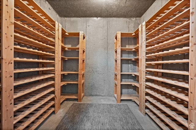 12563 S Bear Castle Cv, Draper, UT 84020 - wine room featuring unfinished concrete floors