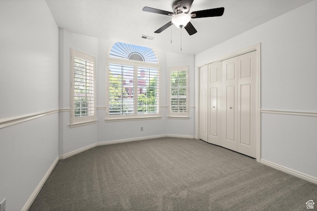 12563 S Bear Castle Cv, Draper, UT 84020 - unfurnished bedroom featuring carpet flooring, baseboards, a ceiling fan, and a closet