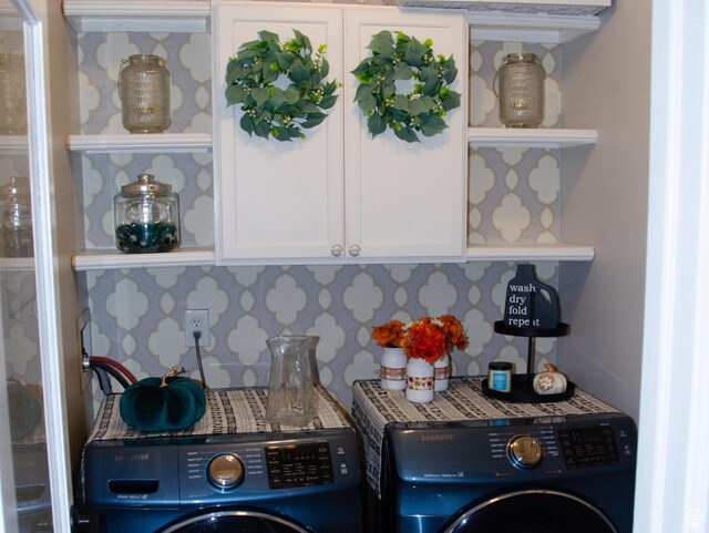 6705 S High Bluff Dr W, West Jordan, UT 84081 - laundry room featuring cabinet space and independent washer and dryer