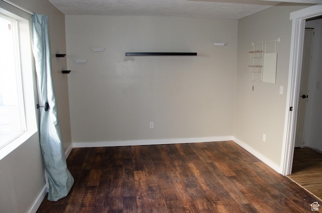 6705 S High Bluff Dr W, West Jordan, UT 84081 - spare room featuring wood finished floors and baseboards