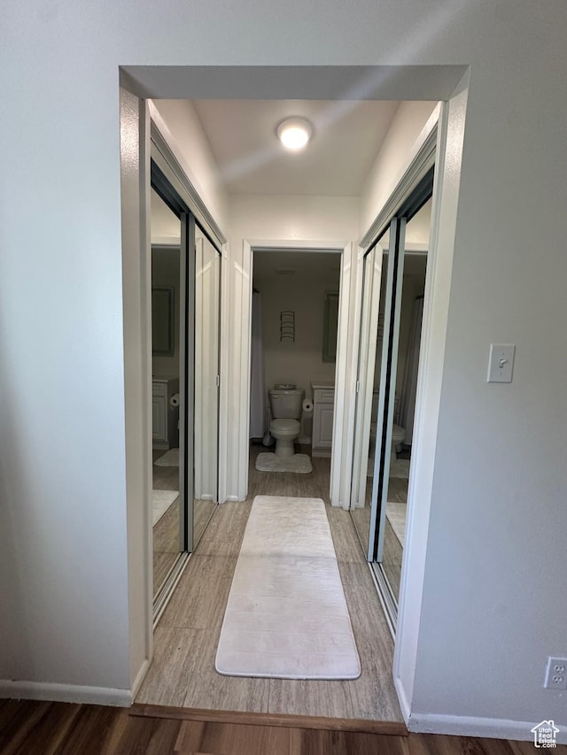 4853 S Woodbridge Dr E Unit 44, Salt Lake City, UT 84117 - hall with wood finished floors and baseboards
