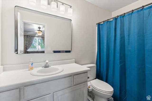 4868 W Cedar Point Peak Dr S, Riverton, UT 84096 - bathroom with toilet, vanity, ceiling fan, and a shower with curtain
