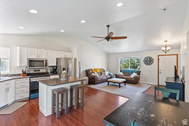 4868 W Cedar Point Peak Dr S, Riverton, UT 84096 - kitchen with appliances with stainless steel finishes, vaulted ceiling, white cabinetry, a kitchen island, and ceiling fan