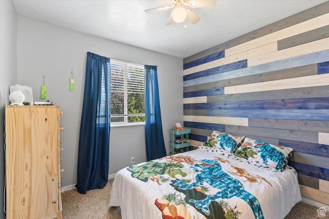 4868 W Cedar Point Peak Dr S, Riverton, UT 84096 - bedroom with wooden walls, carpet floors, baseboards, and a ceiling fan
