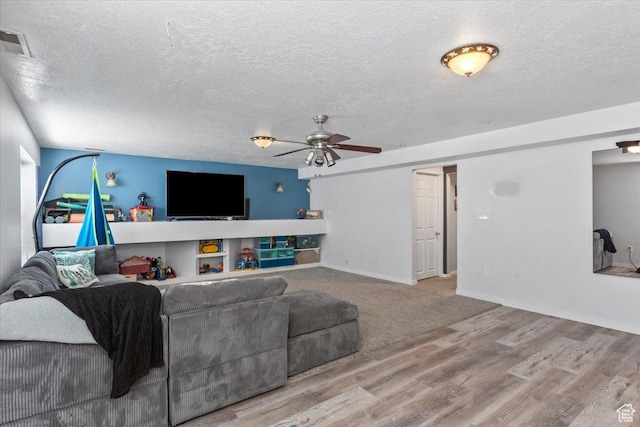 4868 W Cedar Point Peak Dr S, Riverton, UT 84096 - living area with ceiling fan, wood finished floors, a textured ceiling, and baseboards