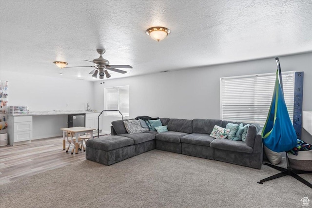 4868 W Cedar Point Peak Dr S, Riverton, UT 84096 - carpeted living area with a textured ceiling and a ceiling fan
