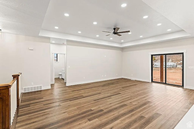 281 N 460 E, Elsinore, UT 84724 - unfurnished room with a tray ceiling, wood finished floors, ceiling fan, baseboards, and recessed lighting