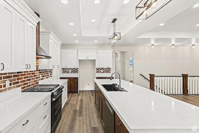 281 N 460 E, Elsinore, UT 84724 - kitchen with range with gas cooktop, a sink, stainless steel dishwasher, a raised ceiling, and recessed lighting