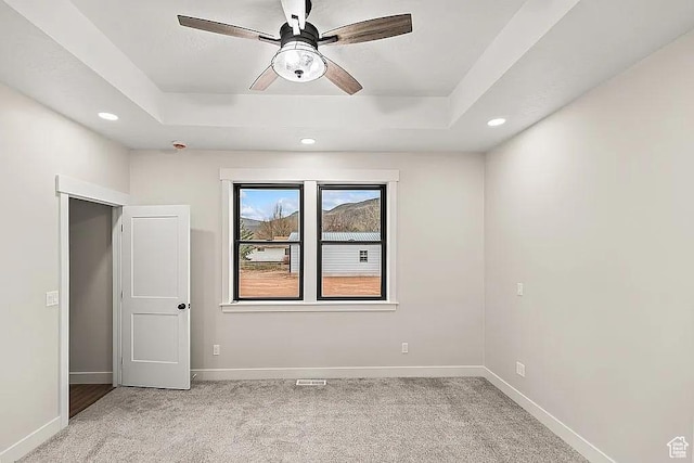 281 N 460 E, Elsinore, UT 84724 - spare room featuring light carpet, a tray ceiling, a ceiling fan, baseboards, and recessed lighting