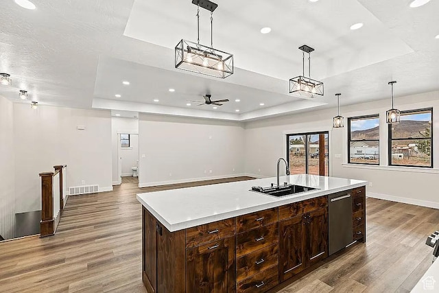 281 N 460 E, Elsinore, UT 84724 - kitchen with a raised ceiling, a sink, light wood finished floors, light countertops, and recessed lighting