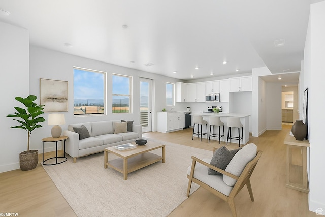 5263 W Reventon Rd S, South Jordan, UT 84009 - living room with light wood-style floors and recessed lighting