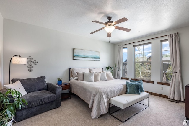 13279 N Alexis Dr, Kamas, UT 84036 - bedroom with light colored carpet, a ceiling fan, a textured ceiling, and baseboards