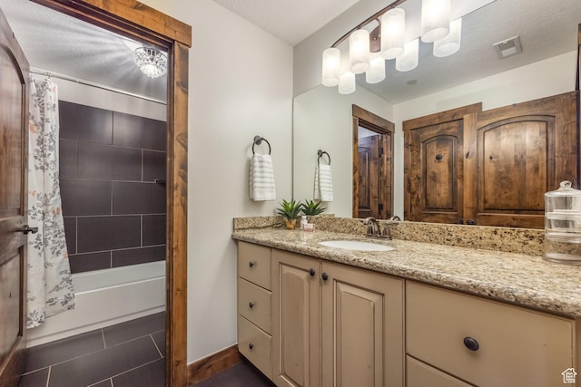 13279 N Alexis Dr, Kamas, UT 84036 - bathroom featuring vanity, shower / bath combo, and baseboards