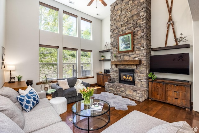13279 N Alexis Dr, Kamas, UT 84036 - living room featuring a ceiling fan, a towering ceiling, a fireplace, and wood finished floors