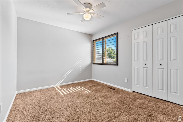 748 N 310 E, Tooele, UT 84074 - unfurnished bedroom featuring carpet, baseboards, a closet, and a ceiling fan