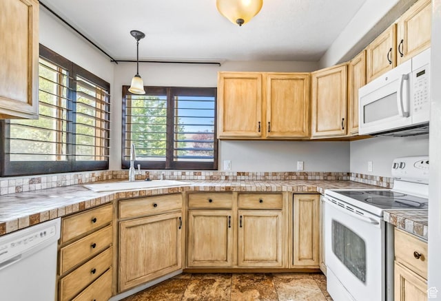 748 N 310 E, Tooele, UT 84074 - kitchen with white appliances, light brown cabinets, a sink, and decorative light fixtures