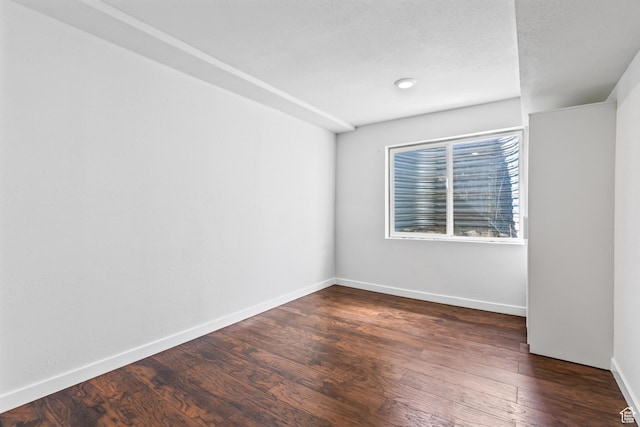 748 N 310 E, Tooele, UT 84074 - unfurnished room with dark wood-style floors and baseboards