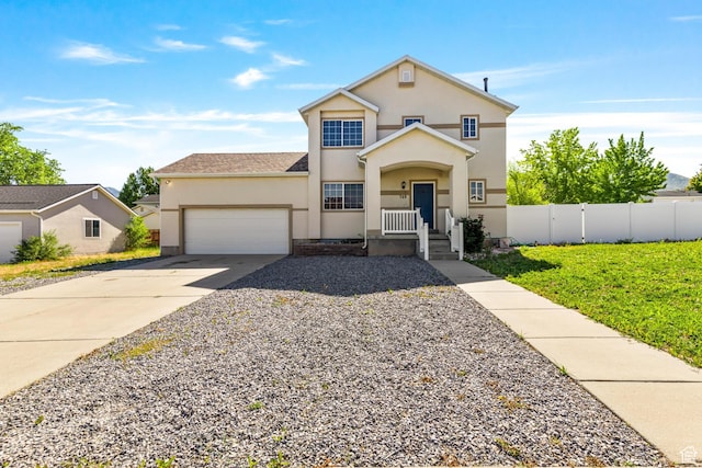 748 N 310 E, Tooele, UT 84074 - traditional-style house with an attached garage, concrete driveway, and stucco siding