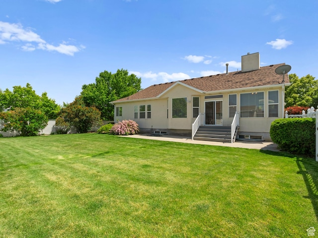 4912 W Rosewood Dr S, South Jordan, UT 84009 - back of house featuring a patio, a lawn, a chimney, entry steps, and stucco siding