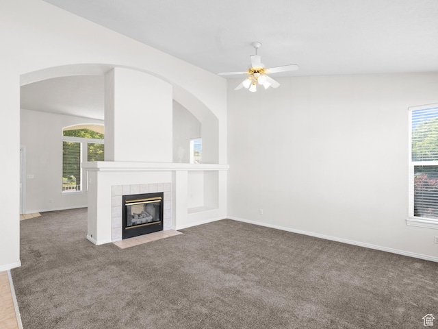 4912 W Rosewood Dr S, South Jordan, UT 84009 - unfurnished living room featuring plenty of natural light, carpet, ceiling fan, and a tiled fireplace