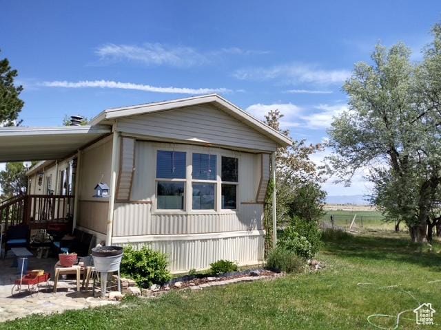 415 E 100 N, Elmo, UT 84521 - view of property exterior with a lawn