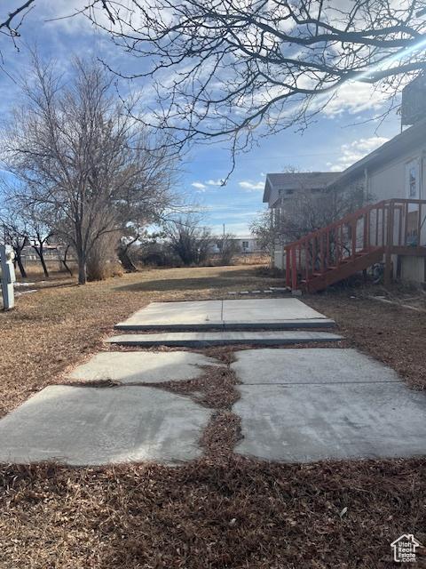 415 E 100 N, Elmo, UT 84521 - view of yard featuring a patio