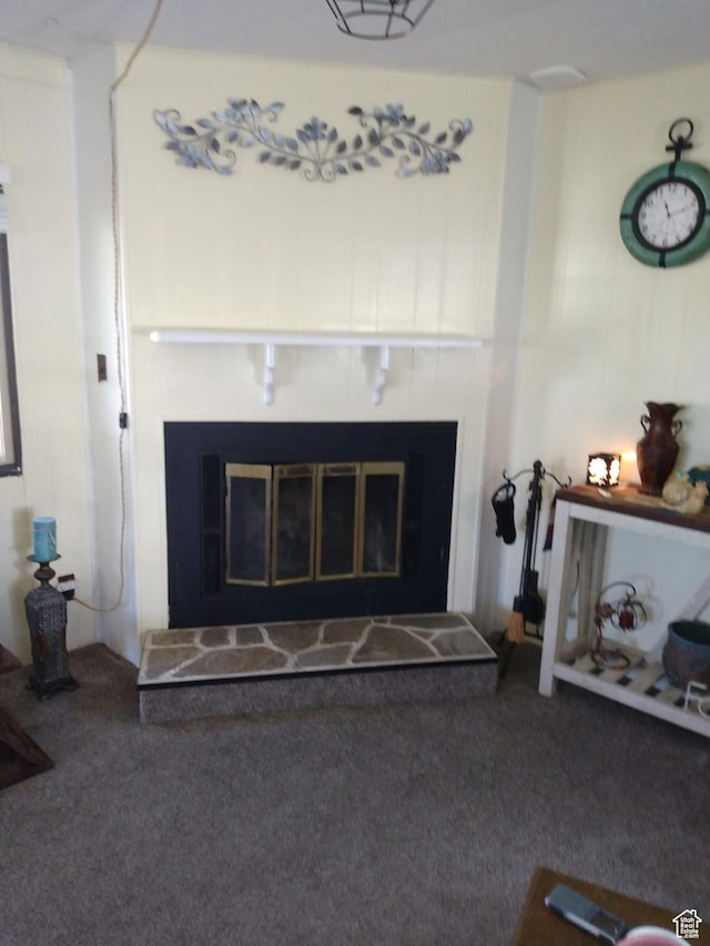 415 E 100 N, Elmo, UT 84521 - detailed view of a glass covered fireplace and carpet flooring