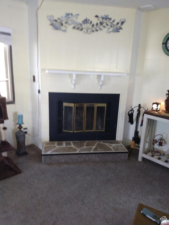415 E 100 N, Elmo, UT 84521 - detailed view of a tiled fireplace and carpet flooring