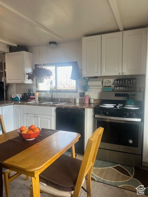 415 E 100 N, Elmo, UT 84521 - kitchen with gas stove, black dishwasher, white cabinetry, and a sink