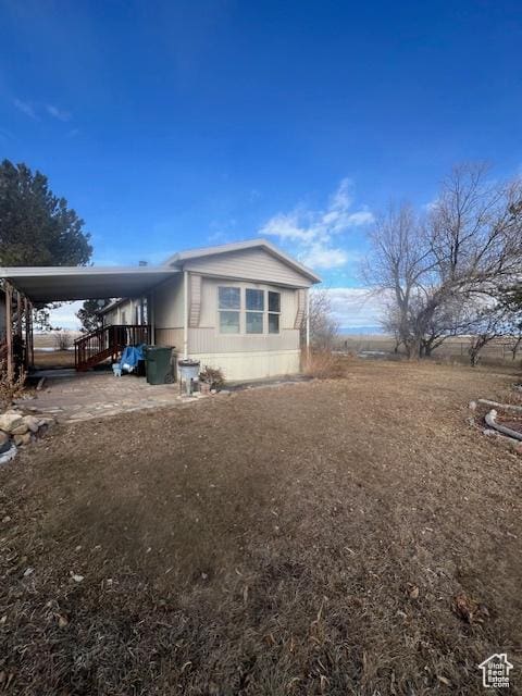 415 E 100 N, Elmo, UT 84521 - view of home's exterior featuring a carport