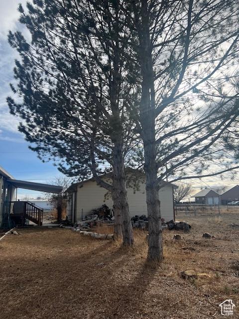 415 E 100 N, Elmo, UT 84521 - view of side of home featuring stairway